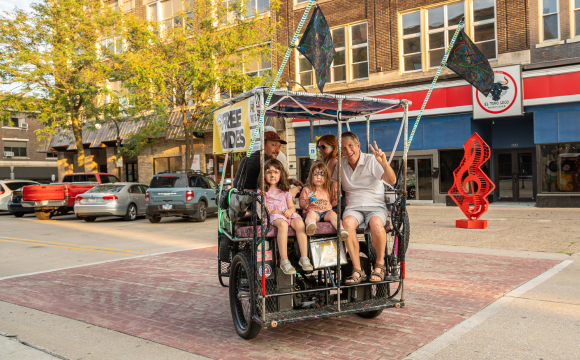 People riding a pedicab