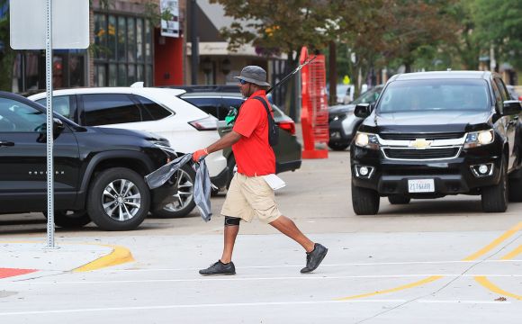 Ambassador walking across 2nd Avenue
