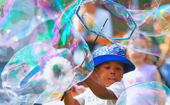 Boy with large bubbles