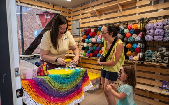 Merchant accepting payment for item in Pop-Up Shop