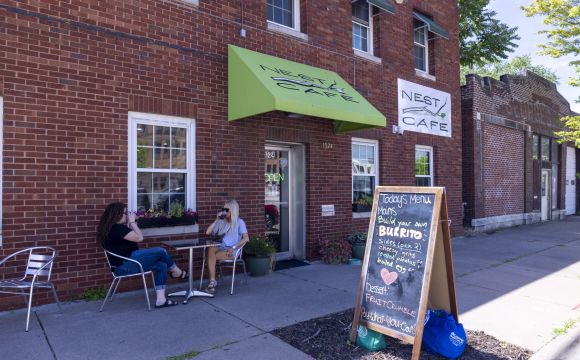 building exterior two ladies sitting at a table at Nest Cafe