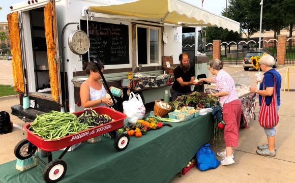 people at a farmers market in Downtown Rock Island
