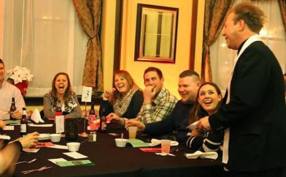 people at a dinner play at Skellington manor