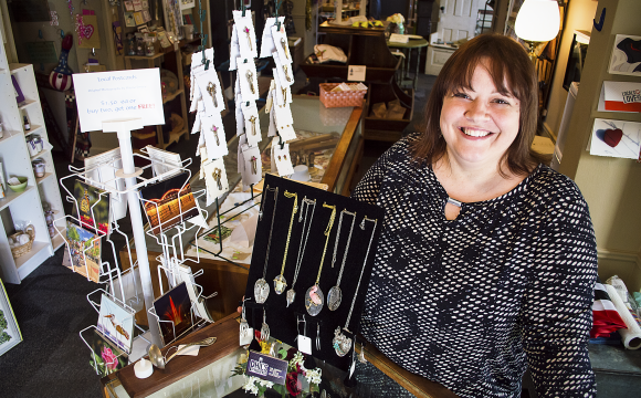 a lady behind a sales counter at Skeleton Key Art & Antiques