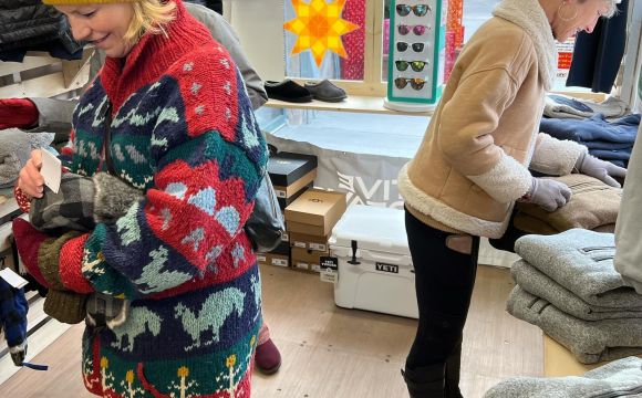 two ladies in winter gear shopping at Arts Alley Pop up Shop