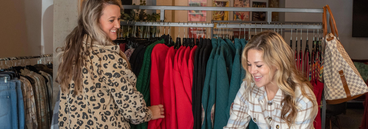 Two women looking at clothes in a Rock Island shop