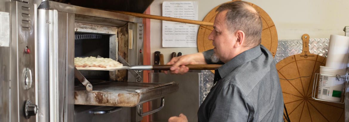 Man cooking food in an oven