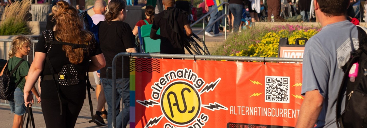 People walk towards a music stage