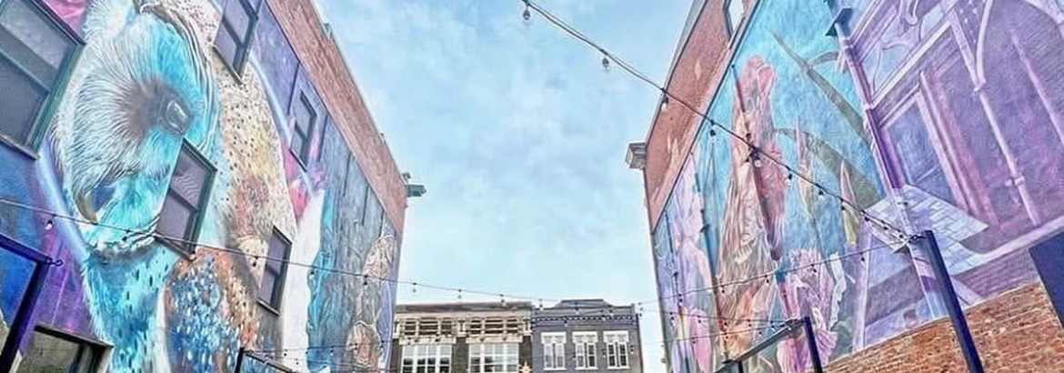 A view of painted art between two buildings