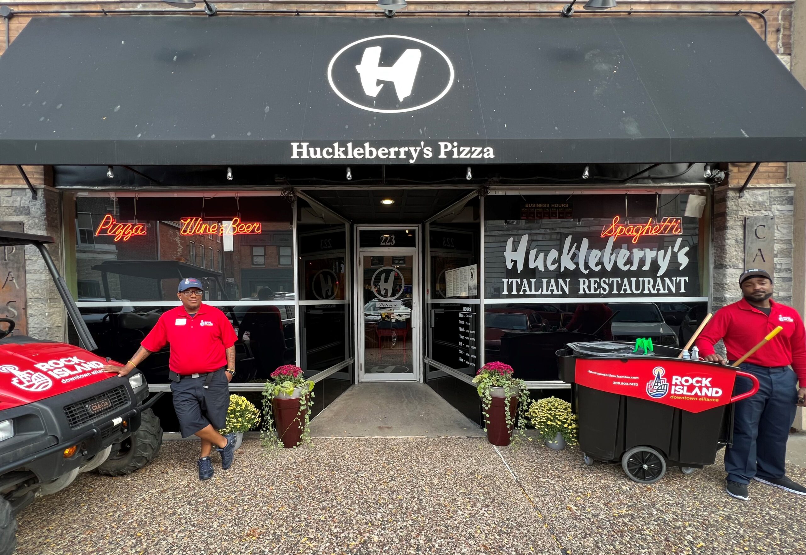 Downtown Alliance Operations Manager De'Andre Robinson, left, and Cleaning Ambassador Derrick King pose for a photo outside of Huckleberry's during the official launch party for the Alliance on Oct. 3, 2023.