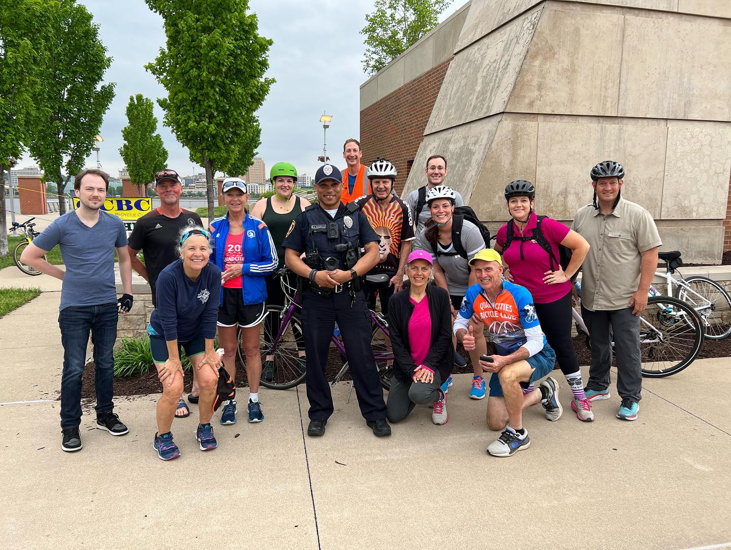 Bicyclists pose for a photo at Schwiebert Riverfront Park in 2022.