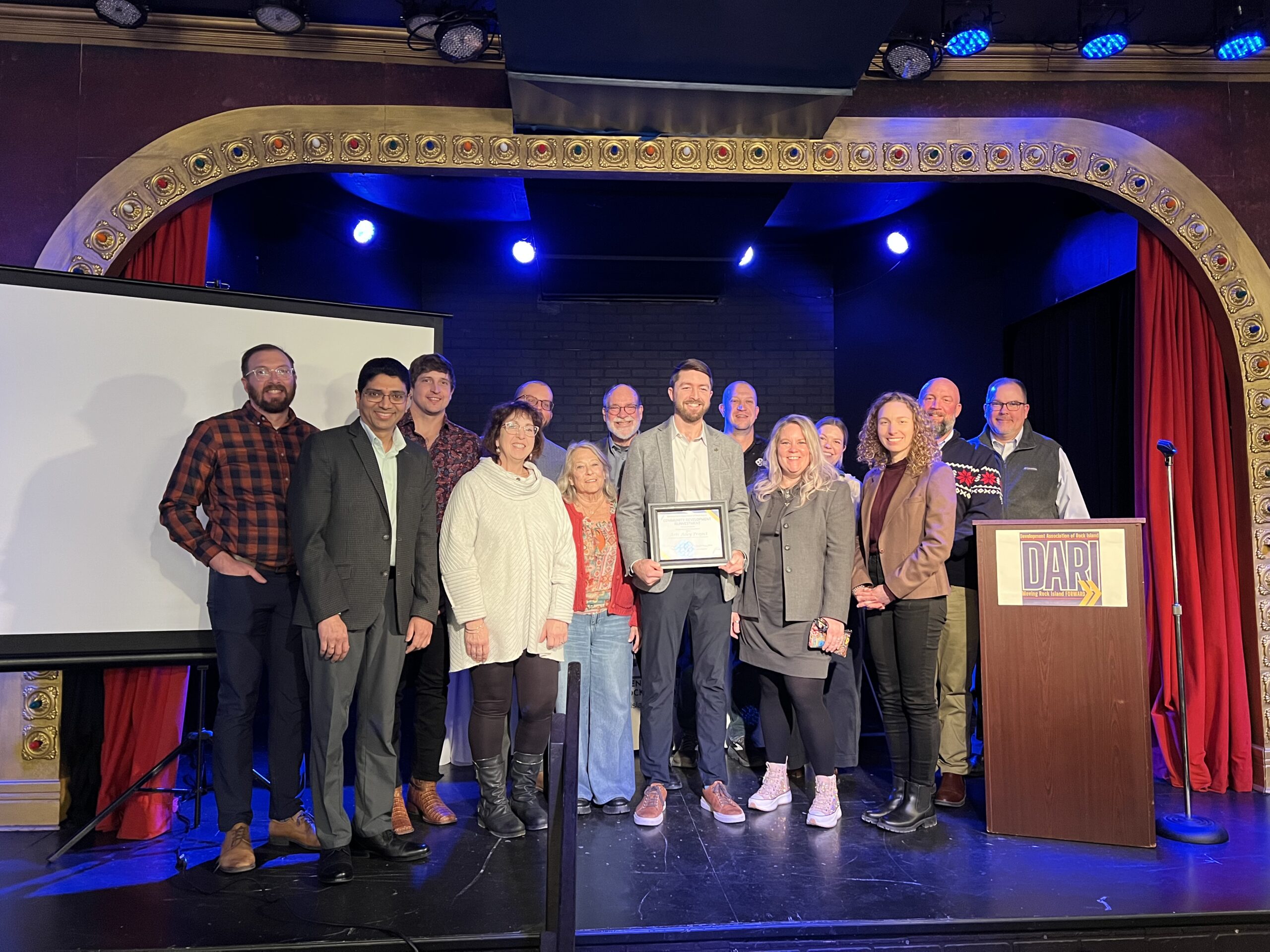 Group of people receiving an award.